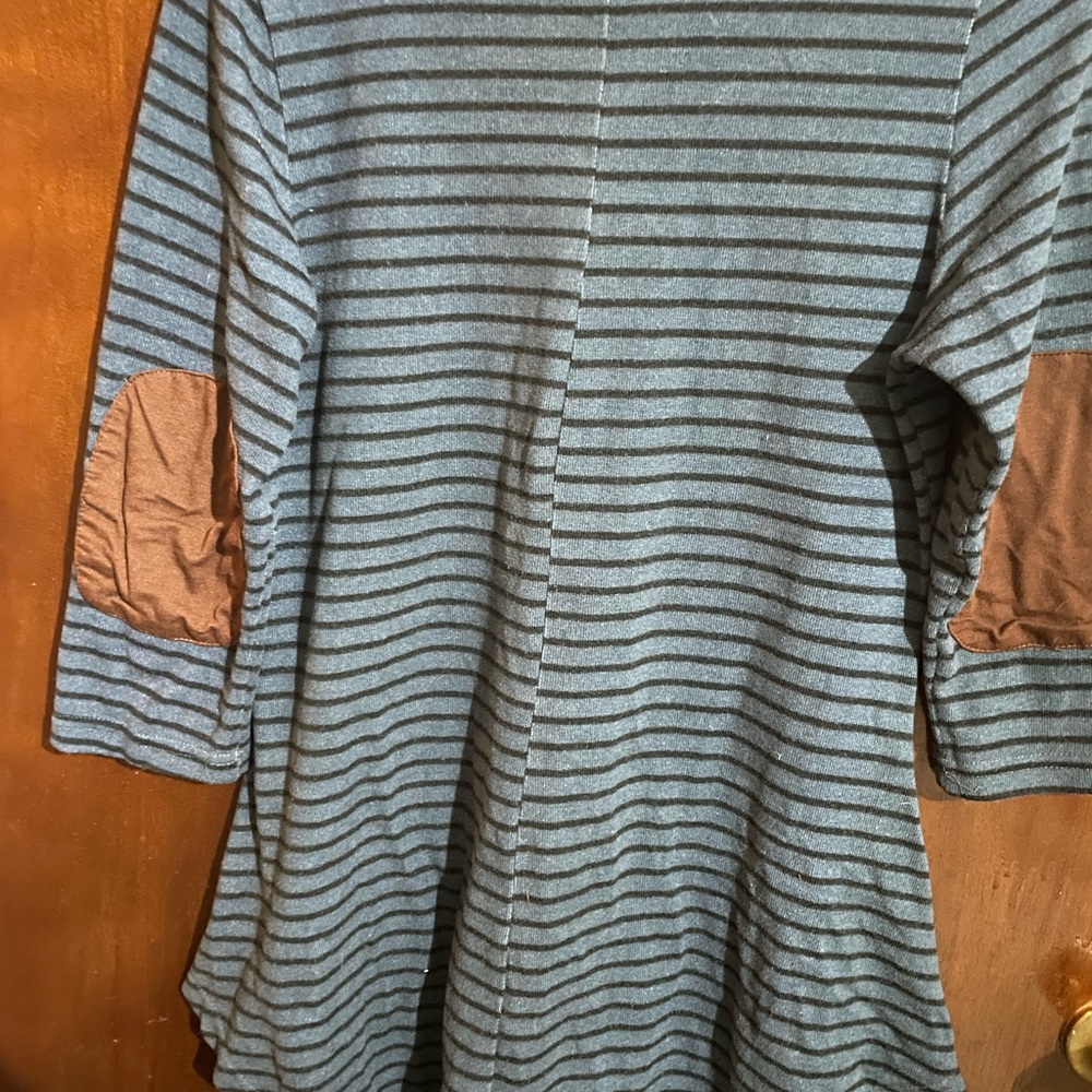 Blue and black striped tunic elbow patch detail